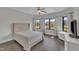 Bright bedroom with a neutral color scheme, large windows, and dark wood flooring at 2004 Yamacraw Dr, Knightdale, NC 27545