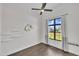 Well-lit bedroom with a large window and decorative wall art at 2004 Yamacraw Dr, Knightdale, NC 27545