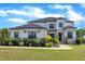 Stunning two-story home featuring a modern design with stone accents and manicured landscaping at 2004 Yamacraw Dr, Knightdale, NC 27545