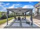 Elegant backyard gazebo with stylish seating, perfect for outdoor relaxation and entertaining guests at 2004 Yamacraw Dr, Knightdale, NC 27545