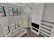 Open-concept living room with soaring ceilings, a fireplace, and ample natural light at 2004 Yamacraw Dr, Knightdale, NC 27545