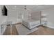 Bright, modern main bedroom with large bed, tray ceiling, and ensuite bathroom at 2004 Yamacraw Dr, Knightdale, NC 27545