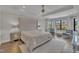 Elegant main bedroom with a sitting area, large windows, and neutral decor at 2004 Yamacraw Dr, Knightdale, NC 27545