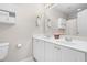 Bright bathroom features a double sink vanity with white cabinets and a large mirror at 203 Worsham Dr., Chapel Hill, NC 27516