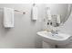Charming bathroom featuring white sink, tile walls, gold fixtures, and decorative mirror at 203 Worsham Dr., Chapel Hill, NC 27516