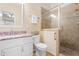Neutral bathroom with a granite countertop vanity and glass enclosed tiled shower at 203 Worsham Dr., Chapel Hill, NC 27516