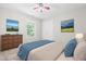 Cozy bedroom features a plush bed, dresser with artwork, and natural light from the window at 203 Worsham Dr., Chapel Hill, NC 27516