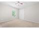 This bedroom features neutral carpet, natural light from window, and a closet door at 203 Worsham Dr., Chapel Hill, NC 27516