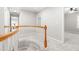 Upstairs hallway with white railing leading to bedrooms and living areas at 203 Worsham Dr., Chapel Hill, NC 27516