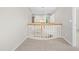 Bright hallway offers a view of the open staircase with natural light at 203 Worsham Dr., Chapel Hill, NC 27516