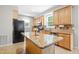 Well-equipped kitchen featuring granite countertops, stainless steel appliances, and an island at 203 Worsham Dr., Chapel Hill, NC 27516