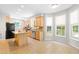 Sunlit kitchen with granite countertops, stainless steel appliances, and a cozy breakfast nook at 203 Worsham Dr., Chapel Hill, NC 27516