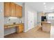 Functional kitchen area with built-in desk space, tile floors, and access to the pantry at 203 Worsham Dr., Chapel Hill, NC 27516