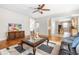Spacious living room with hardwood floors, stylish rug, and open access to the kitchen at 203 Worsham Dr., Chapel Hill, NC 27516