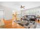 Bright living room with hardwood floors and an open floor plan flowing into the adjacent kitchen at 203 Worsham Dr., Chapel Hill, NC 27516