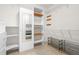 Walk-in closet has built in storage and custom shelving units for maximum organization at 203 Worsham Dr., Chapel Hill, NC 27516