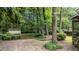 Spacious backyard with a shed and mature trees, providing ample space for outdoor activities at 205 W Oak Ave, Wake Forest, NC 27587