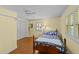 Cozy bedroom with wood floors, double closet, and ceiling fan offers a relaxing retreat at 205 W Oak Ave, Wake Forest, NC 27587