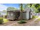 Charming home exterior featuring a screened porch, lush landscaping, and a welcoming facade at 205 W Oak Ave, Wake Forest, NC 27587