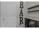 Chic bar area with custom shelving, wine cooler, and granite countertop at 2082 Weston Green Loop Loop, Cary, NC 27513