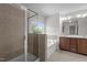 Bright bathroom with a glass-enclosed shower, large tub, and double vanity at 2082 Weston Green Loop Loop, Cary, NC 27513