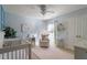 Light blue Bedroom featuring a crib, soft textures, and a comforting ambiance at 2082 Weston Green Loop Loop, Cary, NC 27513