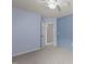Bedroom with a ceiling fan, modern paneled wall, and entry door at 2082 Weston Green Loop Loop, Cary, NC 27513