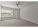 An airy bedroom with a ceiling fan and a bright window at 2082 Weston Green Loop Loop, Cary, NC 27513