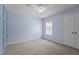 Bedroom with a ceiling fan, a window, and modern paneled wall feature at 2082 Weston Green Loop Loop, Cary, NC 27513