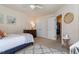 Bright bedroom with a comfortable bed, neutral walls, and a cozy rug at 2082 Weston Green Loop Loop, Cary, NC 27513
