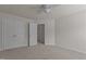 Bedroom with a ceiling fan, double door closet and entry door at 2082 Weston Green Loop Loop, Cary, NC 27513