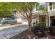 Beautiful townhome with a two-car garage, lush landscaping, and a welcoming entrance at 2082 Weston Green Loop Loop, Cary, NC 27513