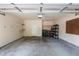 Spacious two-car garage with ample storage space and shelving at 2082 Weston Green Loop Loop, Cary, NC 27513