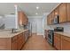Kitchen with stainless steel appliances, granite counters, and wood cabinetry at 2082 Weston Green Loop Loop, Cary, NC 27513
