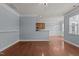 Bright living space with hardwood floors, recessed lighting and a view into dining area at 2082 Weston Green Loop Loop, Cary, NC 27513
