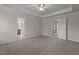 Large main bedroom featuring neutral carpeting and adjoining bath and closet at 2082 Weston Green Loop Loop, Cary, NC 27513