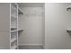A well-organized walk-in closet with shelving for storage at 2082 Weston Green Loop Loop, Cary, NC 27513