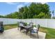 Backyard patio with outdoor seating and white privacy fence at 228 Shingle Oak Rd, Wake Forest, NC 27587