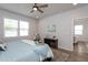 Bright bedroom with a bed, natural light from the window, and neutral tones throughout at 228 Shingle Oak Rd, Wake Forest, NC 27587
