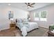 Comfortable bedroom with a cozy bed, stylish decor, and natural light from the window at 228 Shingle Oak Rd, Wake Forest, NC 27587