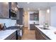 This well-appointed kitchen features quartz countertops, stainless steel appliances, and a gas range at 228 Shingle Oak Rd, Wake Forest, NC 27587
