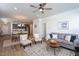 Open-concept living area with modern decor, dining area, and a ceiling fan at 228 Shingle Oak Rd, Wake Forest, NC 27587