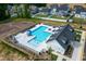 Community pool with a slide, lounge chairs, and nearby clubhouse for relaxing summer days at 228 Shingle Oak Rd, Wake Forest, NC 27587