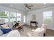 Cozy sunroom featuring bright windows, comfortable seating, and elegant decor at 228 Shingle Oak Rd, Wake Forest, NC 27587
