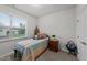 Cozy bedroom with window, featuring carpet and a well-lit interior at 24 W Catalina Ct, Clayton, NC 27527
