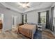 Tranquil bedroom with tray ceiling, lots of natural light, and wood floors, creating a peaceful space at 24 W Catalina Ct, Clayton, NC 27527