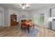 Bright dining area with colorful table setting, fireplace, and French doors to the exterior at 24 W Catalina Ct, Clayton, NC 27527