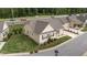 Tan home with well maintained front lawn and adjacent highway at 24 W Catalina Ct, Clayton, NC 27527