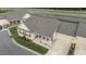 Aerial view of neutral home with rocking chairs on porch at 24 W Catalina Ct, Clayton, NC 27527