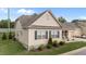 Neutral tan home with dark shutters and inviting front porch at 24 W Catalina Ct, Clayton, NC 27527